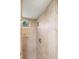 A tiled shower stall featuring accent tile, a soap dish, and a window at 17211 Drayton Ln, Port Charlotte, FL 33948
