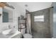 Updated bathroom featuring modern fixtures, tiled shower, and vessel sink at 2005 Gillespie Ave, Sarasota, FL 34234