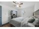 Serene bedroom with modern furnishings, a ceiling fan, and a mounted TV at 2005 Gillespie Ave, Sarasota, FL 34234