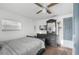 Bright bedroom featuring hardwood floors, a ceiling fan, and modern decor at 2005 Gillespie Ave, Sarasota, FL 34234