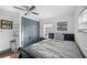 Comfortable bedroom with ceiling fan, closet, and neutral decor at 2005 Gillespie Ave, Sarasota, FL 34234