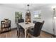 Dining room featuring luxury vinyl plank flooring and stylish furnishings at 2005 Gillespie Ave, Sarasota, FL 34234