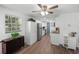 Modern kitchen featuring stainless steel appliances, granite countertops and luxury vinyl plank flooring at 2005 Gillespie Ave, Sarasota, FL 34234