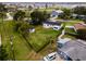 Aerial view of the house, large green backyard, and sheds at 211 22Nd Street Ne Ct, Bradenton, FL 34208