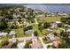 Expansive aerial shot of a neighborhood with waterfront access showcasing the home's prime location near the bay at 211 22Nd Street Ne Ct, Bradenton, FL 34208