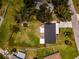 Aerial view showcases the property's boundaries, spacious yard, and surrounding neighborhood at 211 22Nd Street Ne Ct, Bradenton, FL 34208