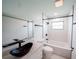 Modern bathroom featuring black fixtures, a stylish vessel sink, and a shower/tub combination at 211 22Nd Street Ne Ct, Bradenton, FL 34208