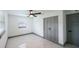 Bedroom featuring white walls, grey trim, recessed lighting, and beautiful marble floors at 211 22Nd Street Ne Ct, Bradenton, FL 34208