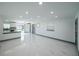 Open-concept living space featuring bright, modern finishes and a seamless flow from the living area to the kitchen at 211 22Nd Street Ne Ct, Bradenton, FL 34208