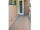 Wood balcony features wood siding and a metal handrail at 2110 Michele Dr, Sarasota, FL 34231