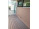 Wood balcony features wood siding and a metal handrail at 2110 Michele Dr, Sarasota, FL 34231