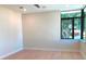 Bedroom with hardwood floors and a large window at 2110 Michele Dr, Sarasota, FL 34231