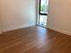 A bedroom featuring hard wood floors and a window with a view at 2110 Michele Dr, Sarasota, FL 34231
