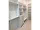 Organized walk-in closet featuring custom shelving, drawers, and ample storage space at 2110 Michele Dr, Sarasota, FL 34231