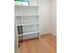 Custom closet with built-in shelving and wood floors at 2110 Michele Dr, Sarasota, FL 34231