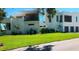 Expansive front lawn and view of the modern designed exterior of the home at 2110 Michele Dr, Sarasota, FL 34231