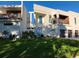 A stunning modern home with a meticulously maintained lawn, showcasing its unique architectural design and curb appeal at 2110 Michele Dr, Sarasota, FL 34231