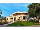 A modern home with clean lines, a lush lawn, and stylish architectural elements, embodying contemporary elegance at 2110 Michele Dr, Sarasota, FL 34231