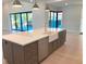 Beautiful kitchen island with farmhouse sink and modern appliances at 2110 Michele Dr, Sarasota, FL 34231