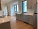 Modern kitchen with stainless steel appliances, stylish gray cabinets, and an open layout at 2110 Michele Dr, Sarasota, FL 34231