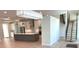 Open-concept kitchen features a large island, modern stainless steel appliances, and brick backsplash at 2110 Michele Dr, Sarasota, FL 34231