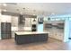 Bright and airy kitchen with stainless appliances, large island, and mosaic backsplash at 2110 Michele Dr, Sarasota, FL 34231