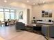 Bright and open living space with modern furnishings, art, and a dining area at 2110 Michele Dr, Sarasota, FL 34231