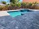 Custom in-ground pool and spa with paver deck and backyard landscaping at 2110 Michele Dr, Sarasota, FL 34231