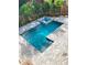 Inviting pool and hot tub surrounded by brick pavers and lush tropical landscaping at 2110 Michele Dr, Sarasota, FL 34231