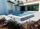 Custom in-ground pool and spa with paver deck and lush landscaping at 2110 Michele Dr, Sarasota, FL 34231