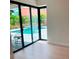 Relaxing backyard featuring a private pool, patio, and tropical landscaping at 2110 Michele Dr, Sarasota, FL 34231