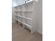 Walk in closet featuring white shelving at 2110 Michele Dr, Sarasota, FL 34231