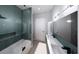 Modern bathroom with stylish tile, double vanity, and glass-enclosed shower at 2221 Wood St, Sarasota, FL 34237