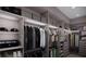 Luxurious walk-in closet with custom shelving, hanging rods, and drawer space at 2221 Wood St, Sarasota, FL 34237
