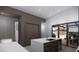 Sleek kitchen featuring a center island, stainless steel appliances, and sliding glass doors at 2221 Wood St, Sarasota, FL 34237