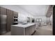 Contemporary kitchen featuring stainless steel appliances and quartz countertops, opening to the living area at 2221 Wood St, Sarasota, FL 34237