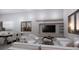 Open-concept living room with modern furniture and integrated kitchen and dining area at 2221 Wood St, Sarasota, FL 34237