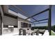 Outdoor kitchen area with a built-in grill, dining table, and comfortable lounge seating at 2221 Wood St, Sarasota, FL 34237