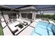 Outdoor living area with a modern pool, lounge seating, and a covered patio at 2221 Wood St, Sarasota, FL 34237