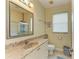 Bathroom featuring marble countertops, tiled floors, and a glass enclosed shower at 23136 Langdon Ave, Port Charlotte, FL 33954