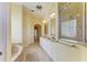 Spacious bathroom with double sinks, granite countertops, tile flooring, and a walk-in shower at 23136 Langdon Ave, Port Charlotte, FL 33954