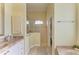 Bathroom featuring marble countertops, tiled floors, and a modern glass enclosed shower at 23136 Langdon Ave, Port Charlotte, FL 33954