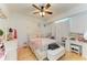 Bright bedroom with hardwood floors, modern furnishings, and ample natural light at 23136 Langdon Ave, Port Charlotte, FL 33954