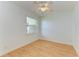 Clean, bright bedroom with laminate floors and a large window at 23136 Langdon Ave, Port Charlotte, FL 33954