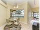 Eat-in kitchen with a view of the pool and an elegant light fixture at 23136 Langdon Ave, Port Charlotte, FL 33954