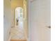 Bright hallway with tile flooring leading to various rooms in the home at 23136 Langdon Ave, Port Charlotte, FL 33954