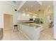 Bright kitchen with white cabinets, granite countertops, stainless appliances and breakfast bar at 23136 Langdon Ave, Port Charlotte, FL 33954