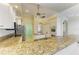 Spacious kitchen featuring granite counters, stainless steel appliances, and ample cabinet space at 23136 Langdon Ave, Port Charlotte, FL 33954