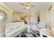 Spacious living room with tile floors, white couches, a glass coffee table, and an open floor plan at 23136 Langdon Ave, Port Charlotte, FL 33954