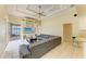 Comfortable living area with access to outdoor patio and connecting kitchen area at 23136 Langdon Ave, Port Charlotte, FL 33954